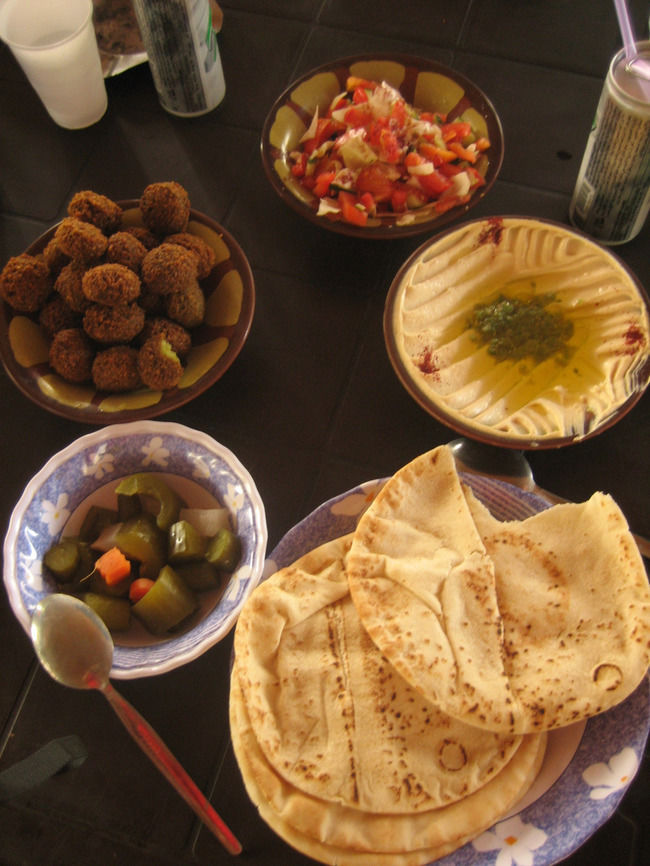 Jordan food -Hummus, falafel, salad, pickles and khubz (pita). A typical Jordanian breakfast.
