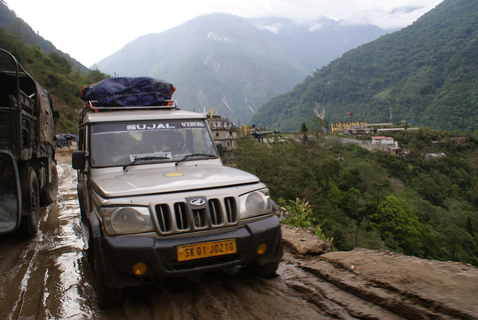 Photo of A SUV behind us negotiating muddy & slippery track by Subhrajyoti Parida