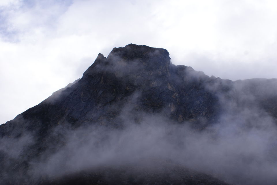 Photo of Clouds giving way to the mountain top.. by Subhrajyoti Parida