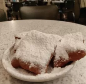 Photo of cafe du monde, Dauphine Street, New Orleans, LA, USA by Sukruti Gandham