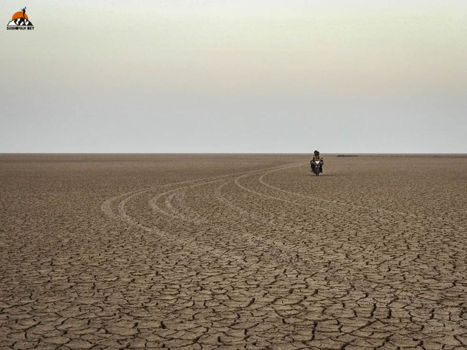 Photo of Two honeymooners and one bike in Kutch by JourneyJournals