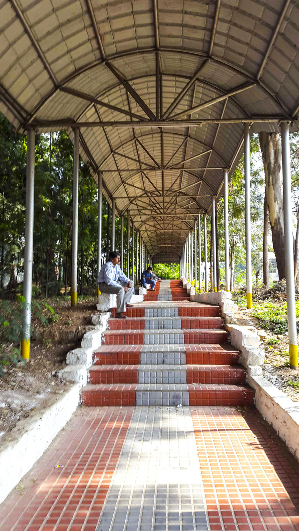 Photo of Walking around Malgudi, with a book and water-bottle in hand 17/65 by Taushik Mandal