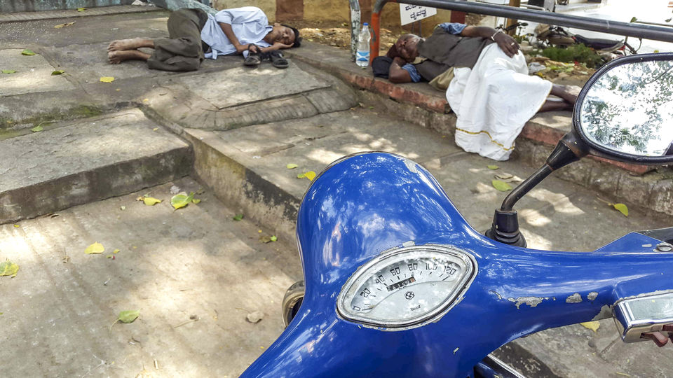 Photo of Walking around Malgudi, with a book and water-bottle in hand 30/65 by Taushik Mandal
