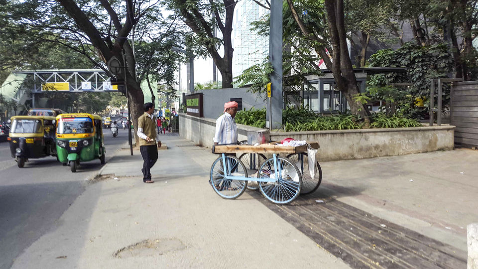 Photo of Walking around Malgudi, with a book and water-bottle in hand 63/65 by Taushik Mandal
