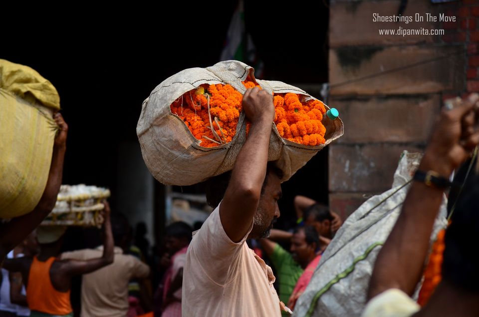 Photo of Mallik Ghat Flower Market- A Riot Of Colors Under Howrah Bridge 14/21 by Dipanwita Chakraborty