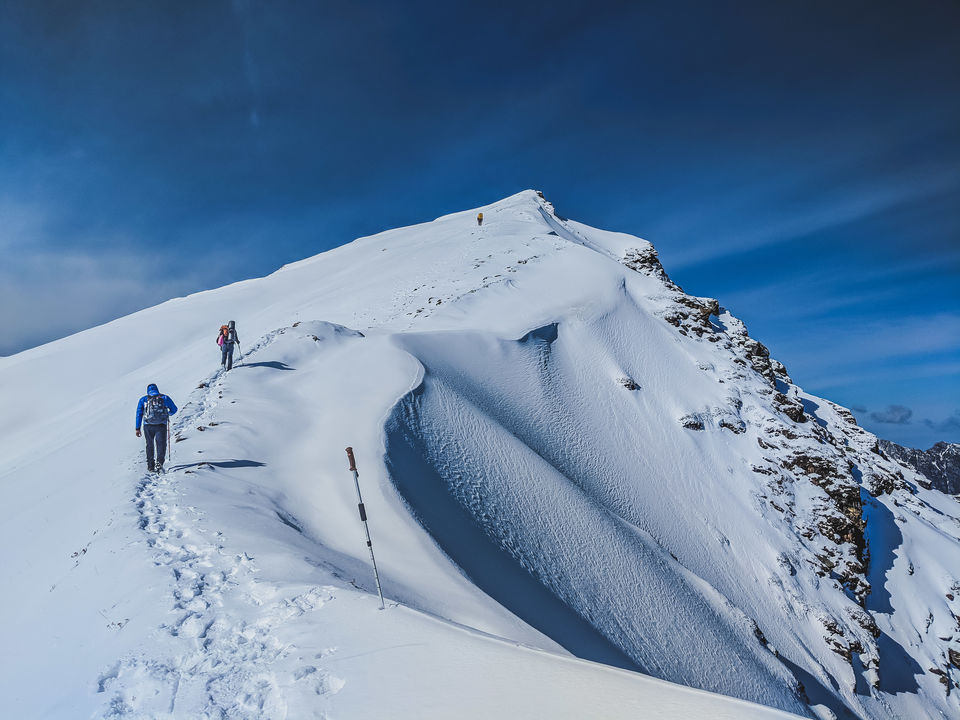 Photo of Sar Pass - A frozen lake, a ridge and snow slides at 14k feet by Mouna Nanaiah