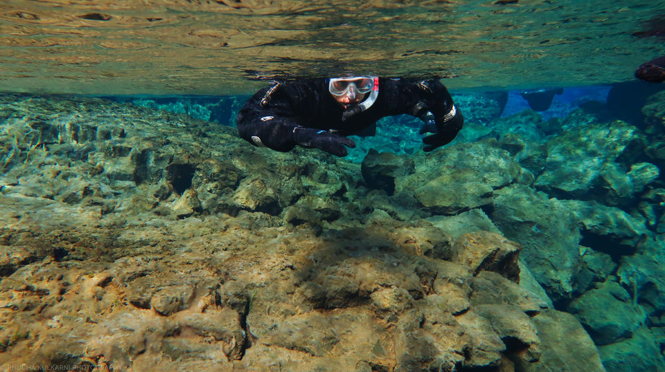 Photo of Snorkelling Between Two Slices of the Earth : Silfra in Iceland 4/5 by Rhucha Kulkarni