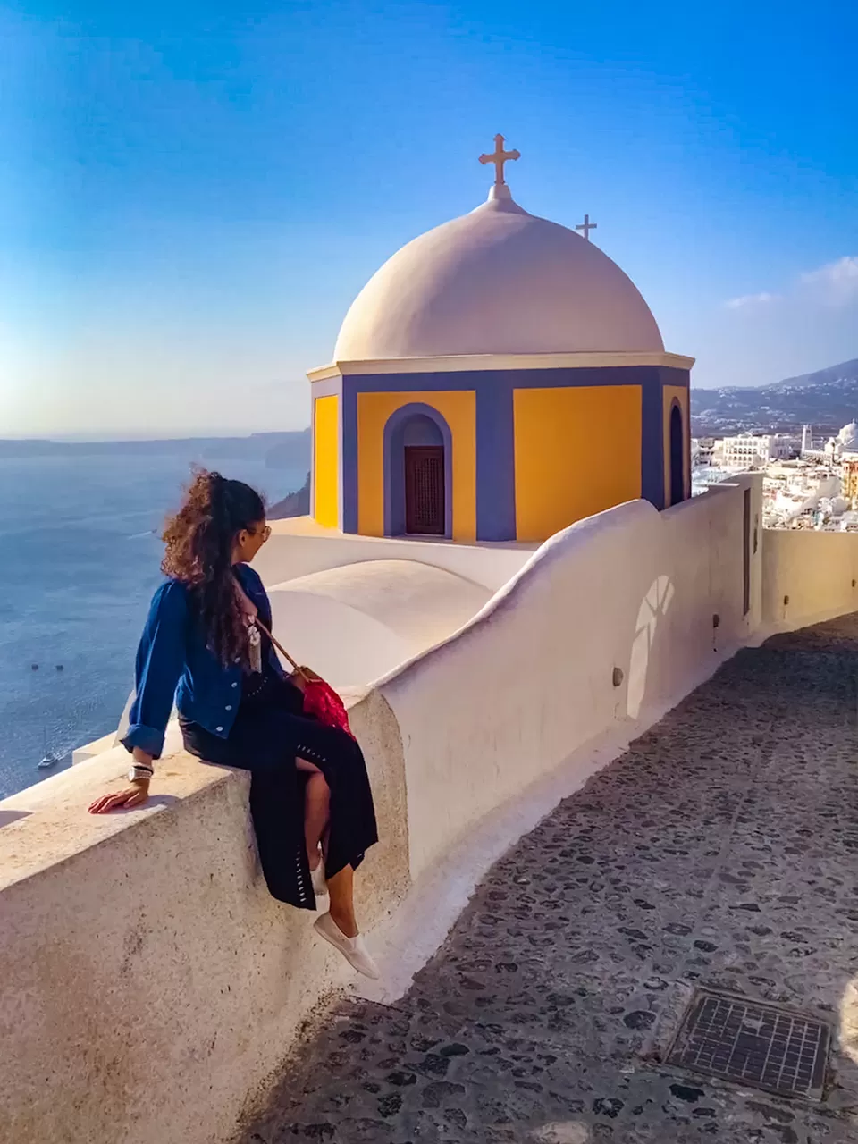 Photo of Fira, Greece by Kadambari Bhatte (curlytravelmess)