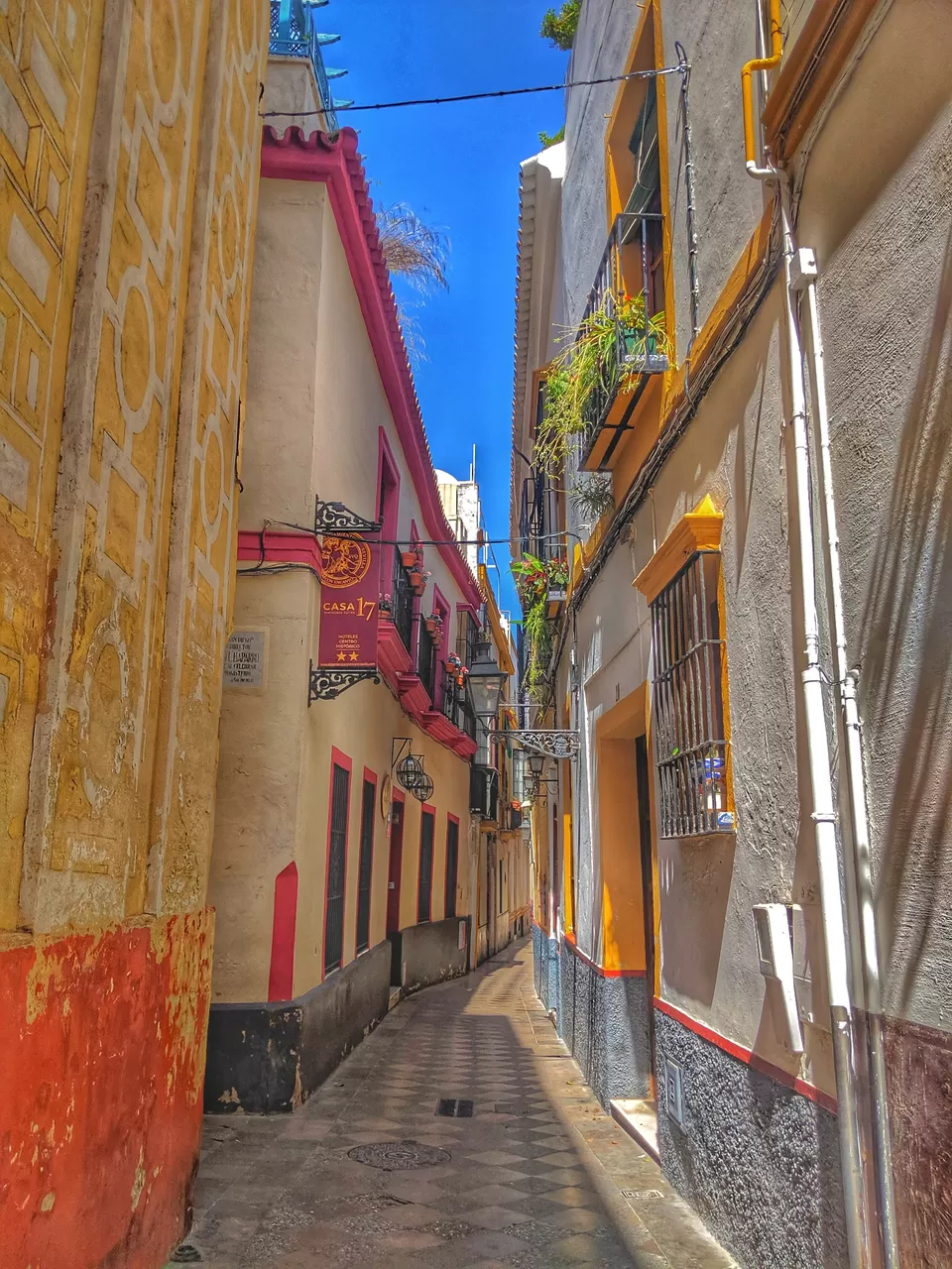 Photo of Barrio de Santa Cruz, Calle Mesón del Moro, Sevilla, Spain by Meenal Kharade