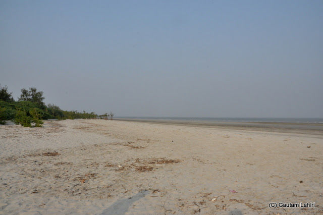 Photo of Bakkhali, oneness of river, sand and sea under the crimson sun by Gautam Lahiri