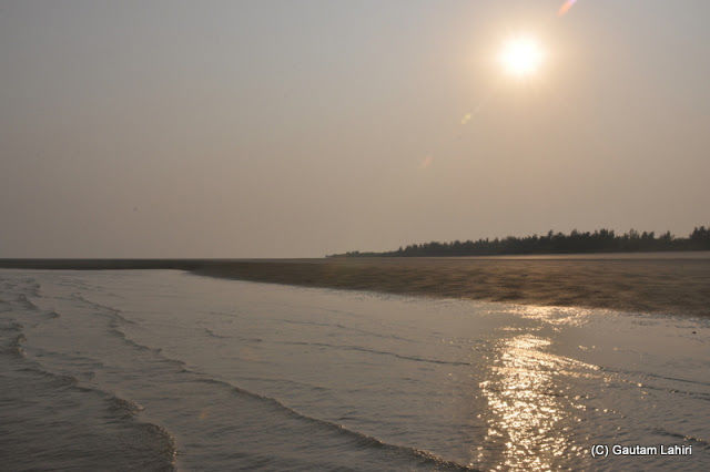 Photo of Bakkhali, oneness of river, sand and sea under the crimson sun by Gautam Lahiri