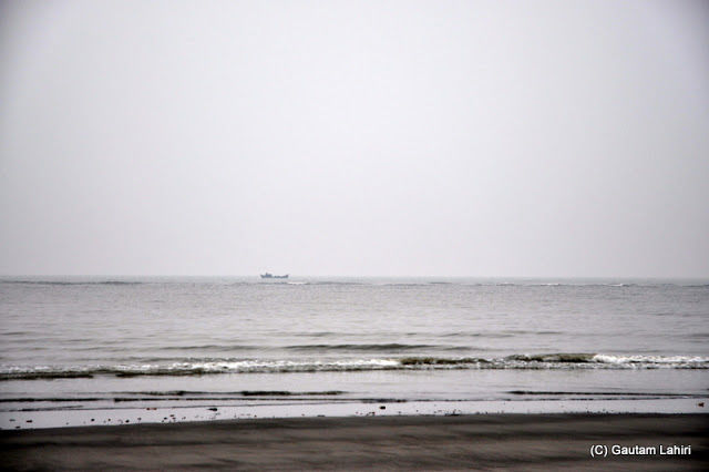 Photo of Bakkhali, oneness of river, sand and sea under the crimson sun by Gautam Lahiri