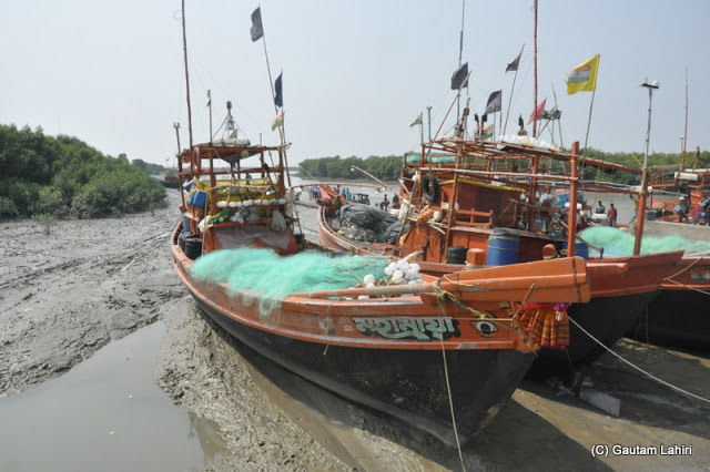 Photo of Bakkhali, oneness of river, sand and sea under the crimson sun by Gautam Lahiri