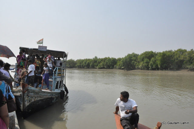 Photo of Bakkhali, oneness of river, sand and sea under the crimson sun by Gautam Lahiri