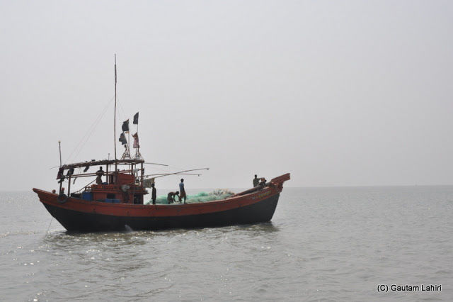 Photo of Bakkhali, oneness of river, sand and sea under the crimson sun by Gautam Lahiri