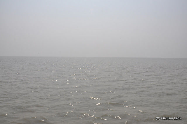 Photo of Bakkhali, oneness of river, sand and sea under the crimson sun by Gautam Lahiri