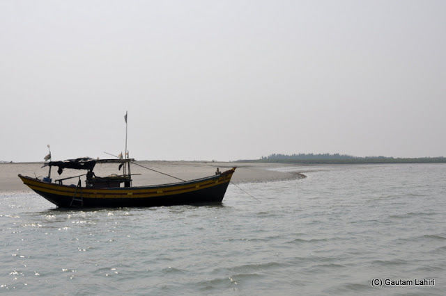 Photo of Bakkhali, oneness of river, sand and sea under the crimson sun by Gautam Lahiri