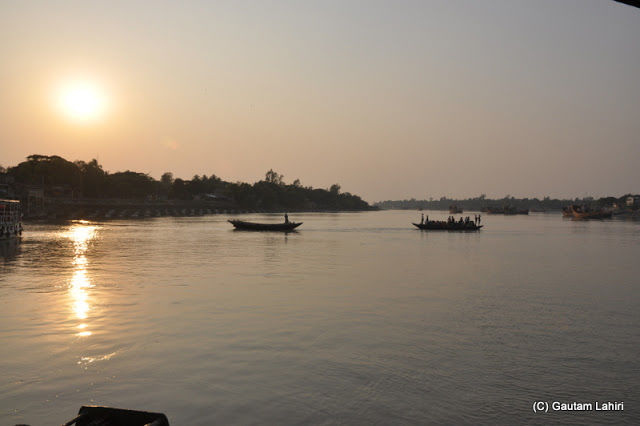 Photo of Bakkhali, oneness of river, sand and sea under the crimson sun by Gautam Lahiri