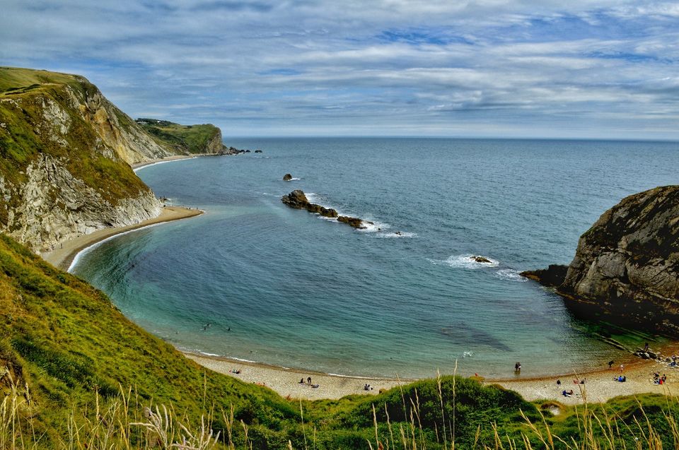 Photo of A first English summer at first natural UNESCO World Heritage site at Durdle Door, England. by Amyth Singh