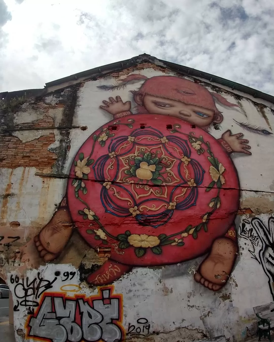 Photo of Alex Face mural graffiti @ Soi Romanee Phuket By Kolkata Nomads