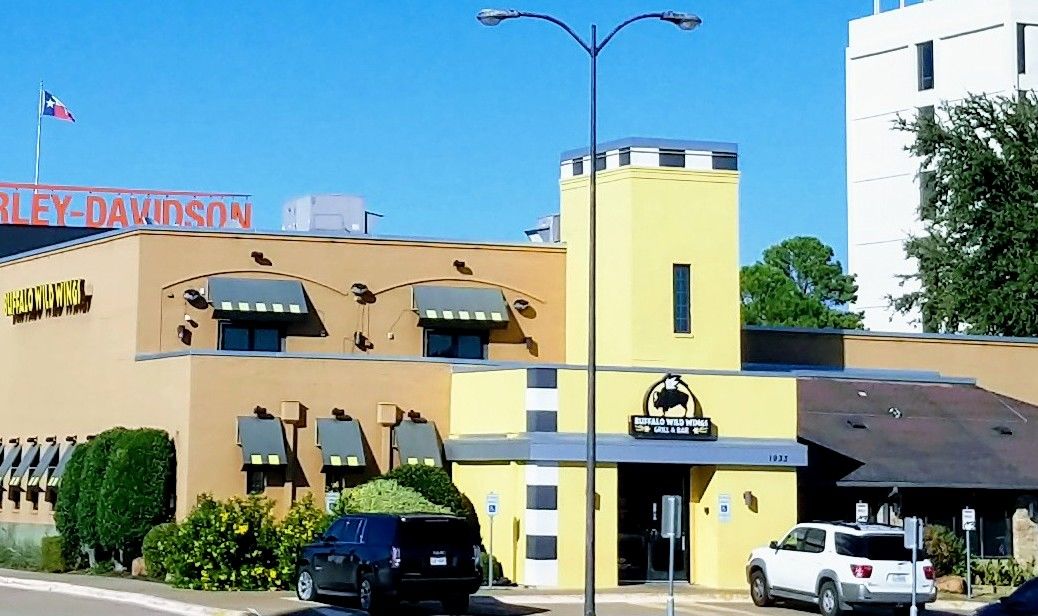 Buffalo Wild Wings at 7 minutes drive to the southeast of Bedford dentist Beelman Dental