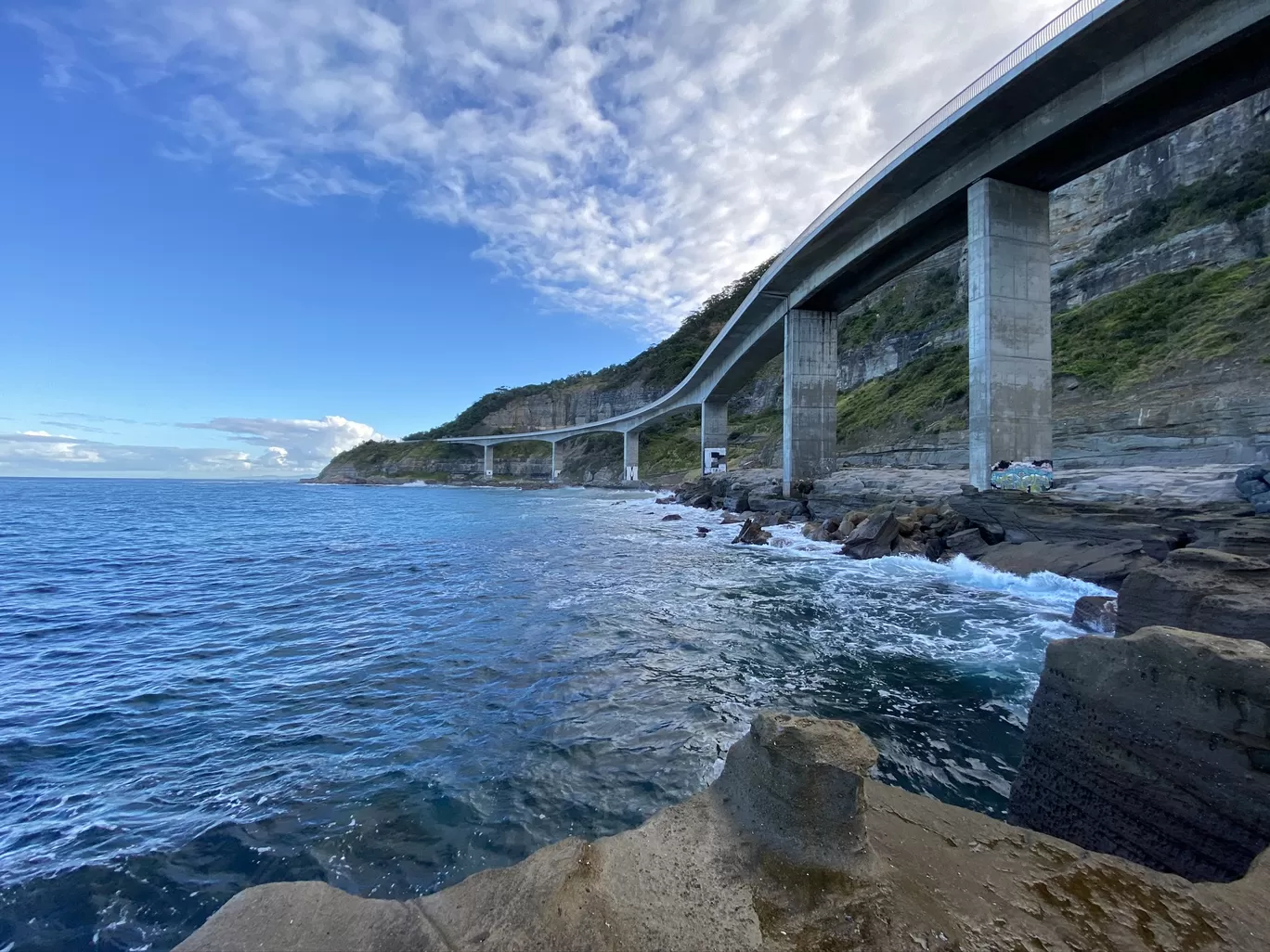 Photo of Sea Cliff Bridge By The Globetrotter Duo