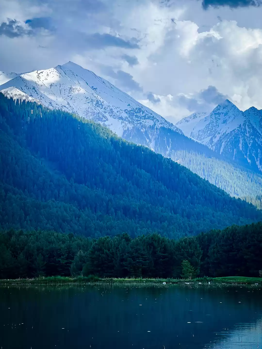 Photo of Calm water,tall moun